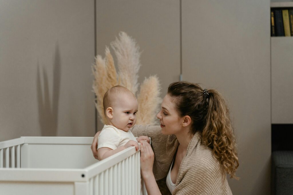 Parents decorating a baby nursery together.